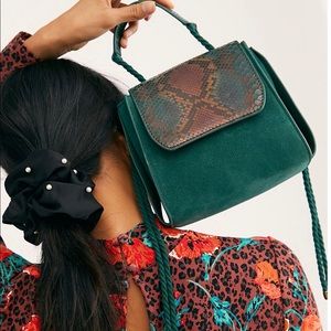 Uptown Embossed Snake Clutch